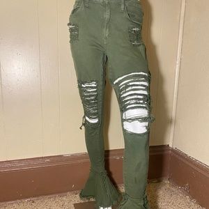 Green distressed skinny jeans